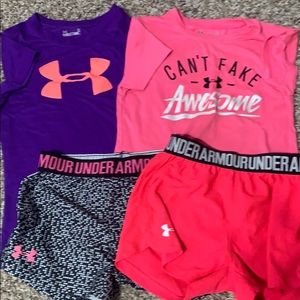 2  Under Armour shirts and 2 Under Armour shorts.